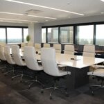 Boardroom with white table and office chairs