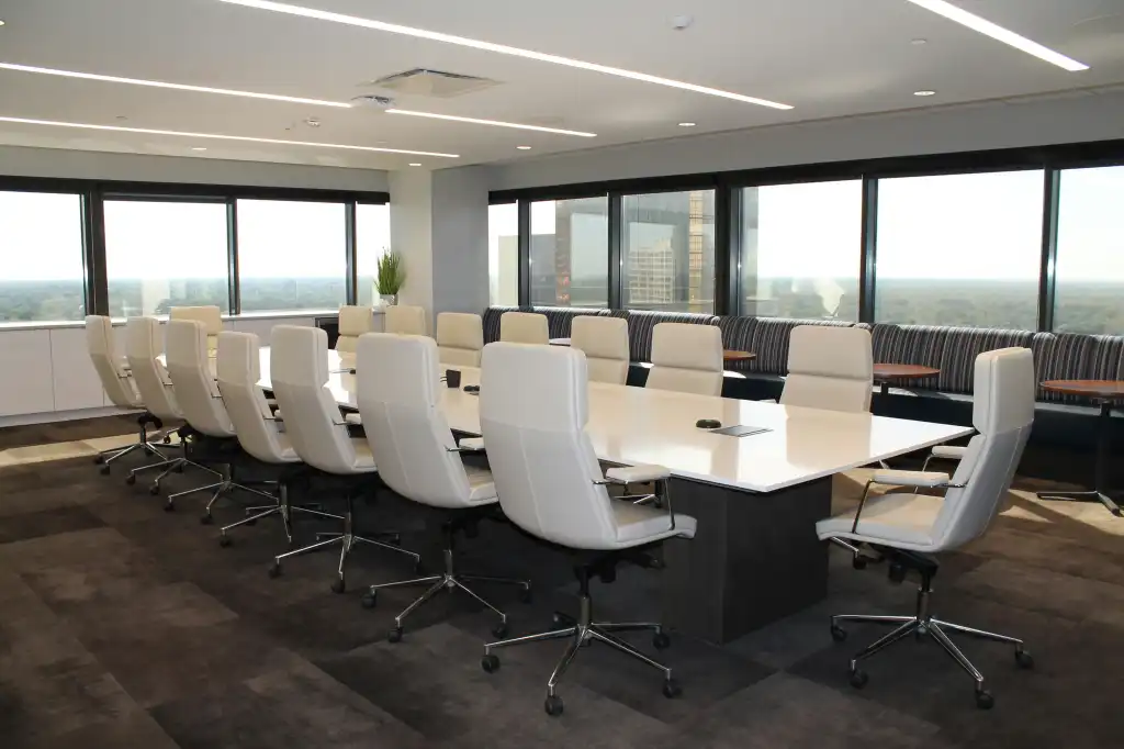 Boardroom with white table and office chairs