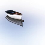 White boat drifting on water