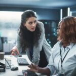 Team of Three Diverse Software Developers Talk, Discuss an AI Project