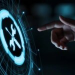A hand reaching out to a hologram displaying an icon of a screwdriver crossed over a wrench.