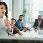 Manager, businesswoman and whiteboard for presentation, training and coaching for investment in company. Team, leader and workshop meeting for learning, proposal and brainstorming ideas for finance