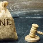 A picture of a money bag with the word fine on it
