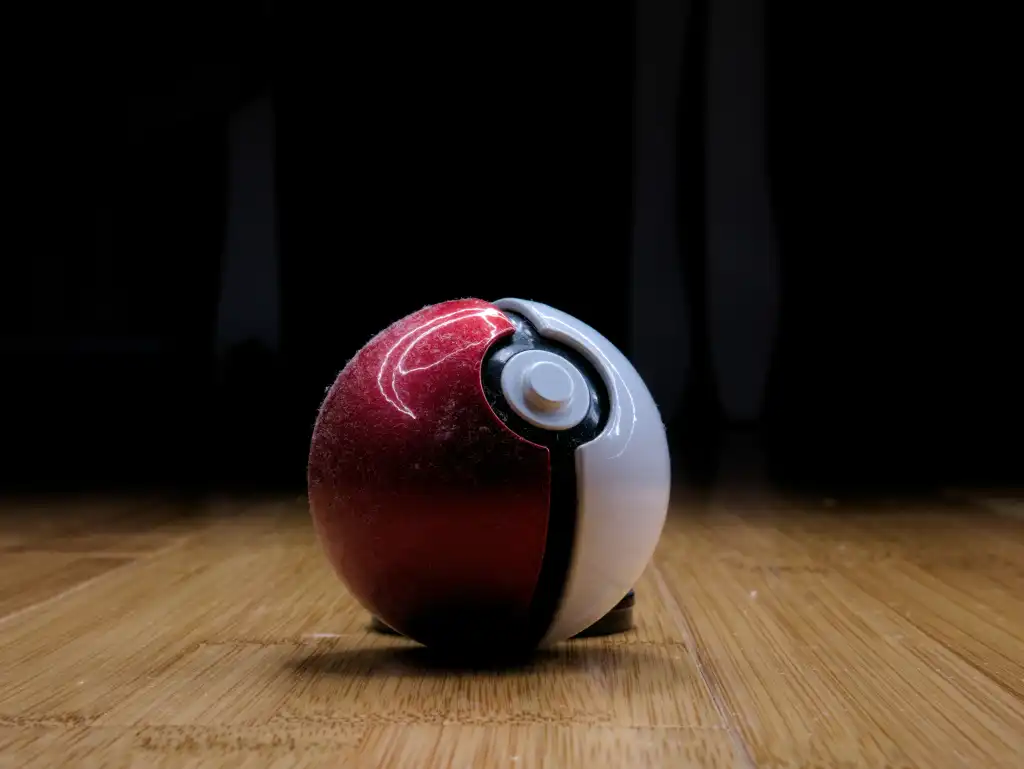 Red and white round plastic toy