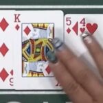 A screenshot of a dealer making a mistake with four cards on the flop