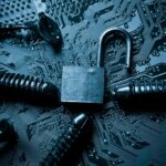 computer security breach due to worm attack - worm on computer circuit board with open security lock