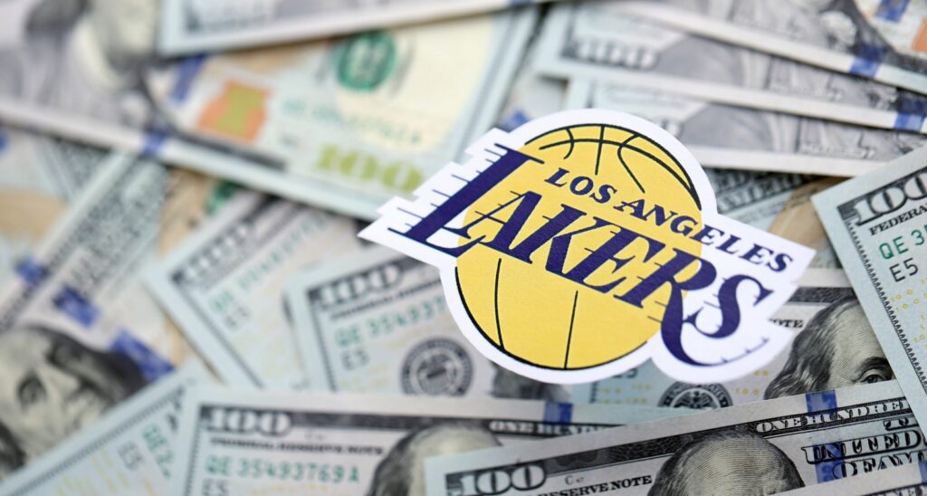 A picture of the Los Angeles Lakers logo on top of cash