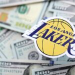 A picture of the Los Angeles Lakers logo on top of cash