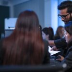 In a 24 7 Security Operations Center, a diverse incident response team works together under pressure, analyzing real-time threat intelligence data to defend against a live cyberattack.