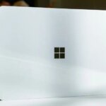 Windows logo on white laptop being stood on its side