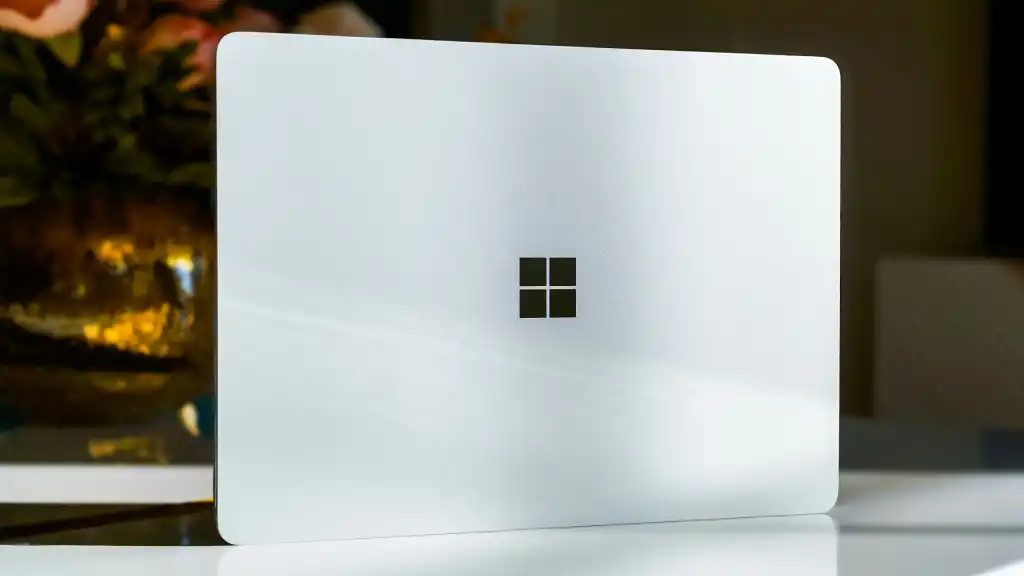 Windows logo on white laptop being stood on its side