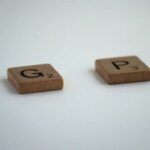 Scabble letters spelling out the word gap with the
