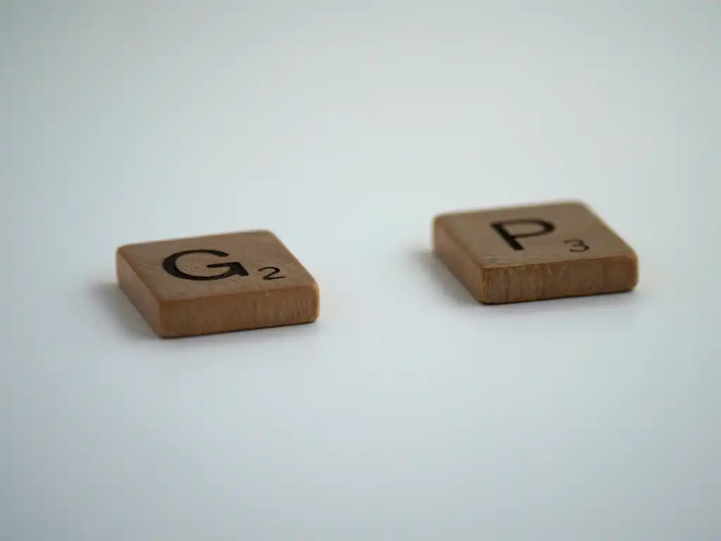Scabble letters spelling out the word gap with the