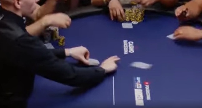 A picture of a dealer using the slide method to deal cards