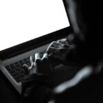 Hacker working on a laptop