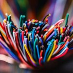 Bundle of thick colorful electrical cables used in telecommunication and information systems. Industrial wiring representing network infrastructure, power distribution, and technical connectivity.