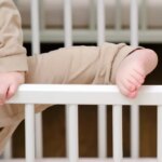 Child escapes from the crib by climbing over the railing.