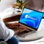 Windows 11 logo on the laptop screen. User with the most popular operating system of Microsoft. Rosario, Argentina - February 01, 2025.