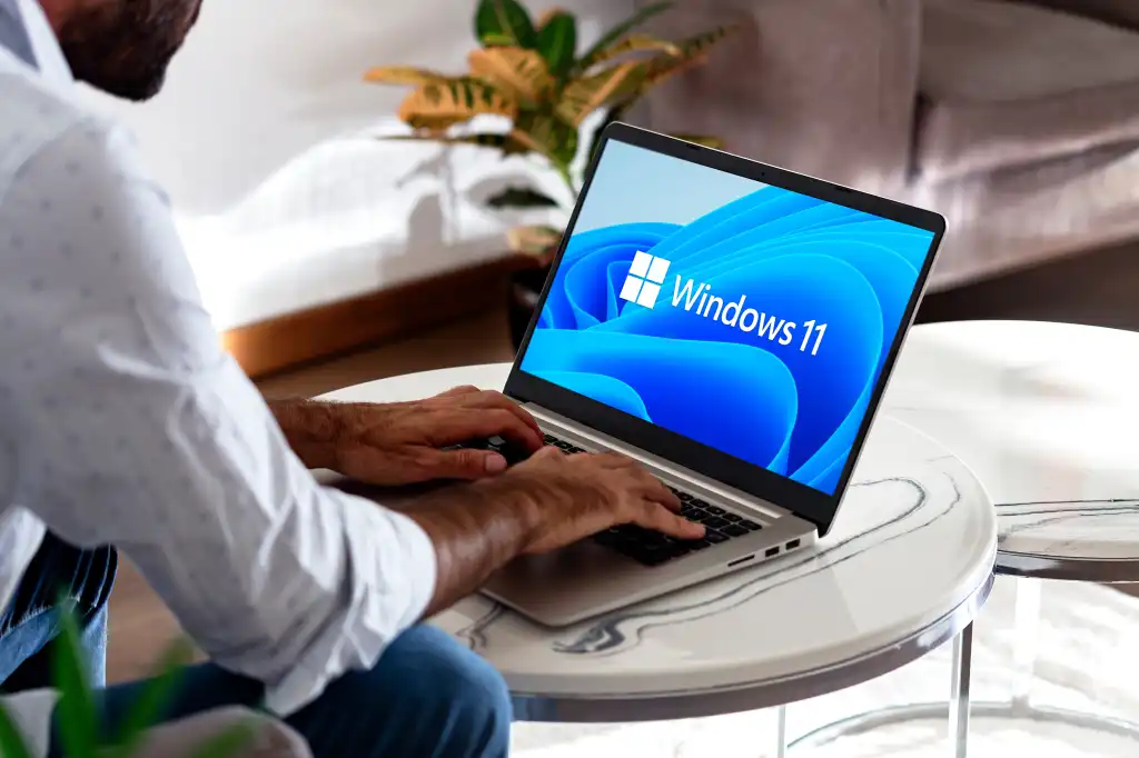 Windows 11 logo on the laptop screen. User with the most popular operating system of Microsoft. Rosario, Argentina - February 01, 2025.