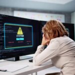 Senior Analyst Woman Worries About Cyber Ransomware Attack On Business PC.