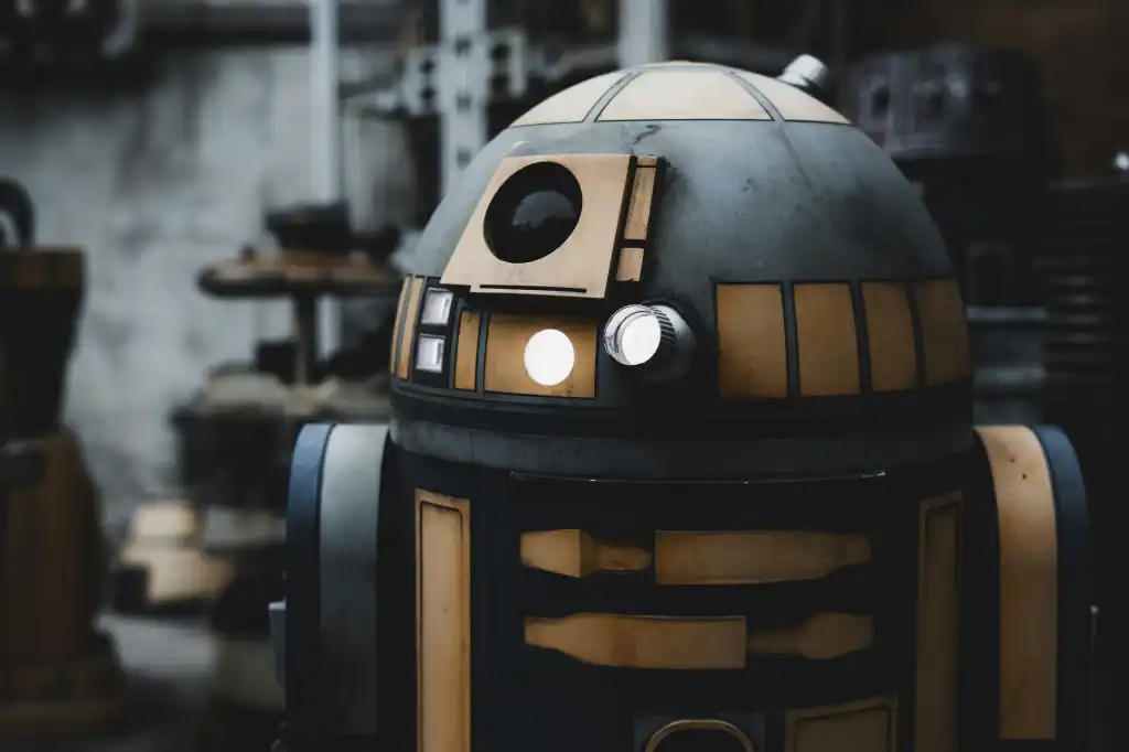 Blue and gold droid with a glowing light, from Disney