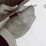 A picture of a man writing a cease & desist letter