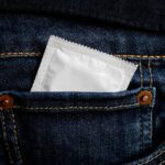 A picture of a condom in a jean pocket