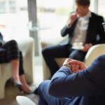 Check, watch or businessman in meeting, discussion or collaboration for teamwork or growth. Appointment, time management or financial manager in office planning for loan, feedback report or project