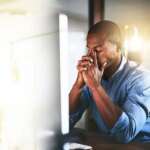 shutterstock 2357434697 office burnout frustration fatigue stress headache