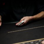 A picture of a poker dealing pitching cards