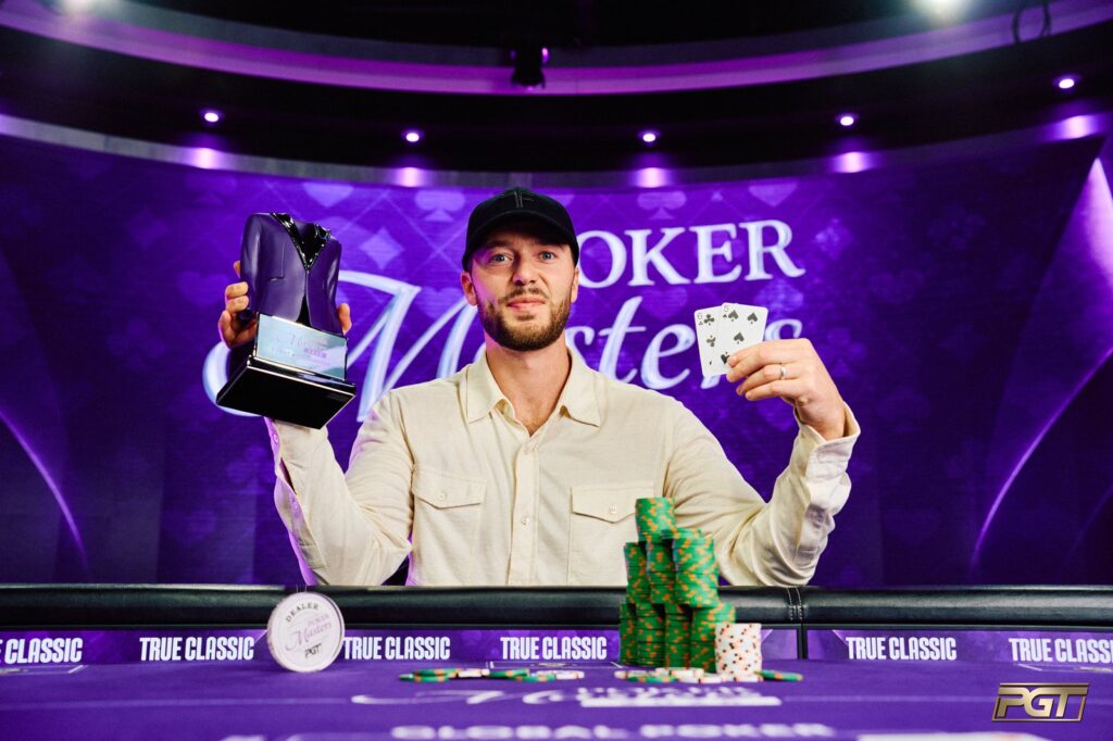 Sean Winter holds the Poker Masters event no. 10 trophy at the PokerGO Studio