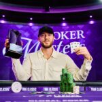 Sean Winter holds the Poker Masters event no. 10 trophy at the PokerGO Studio